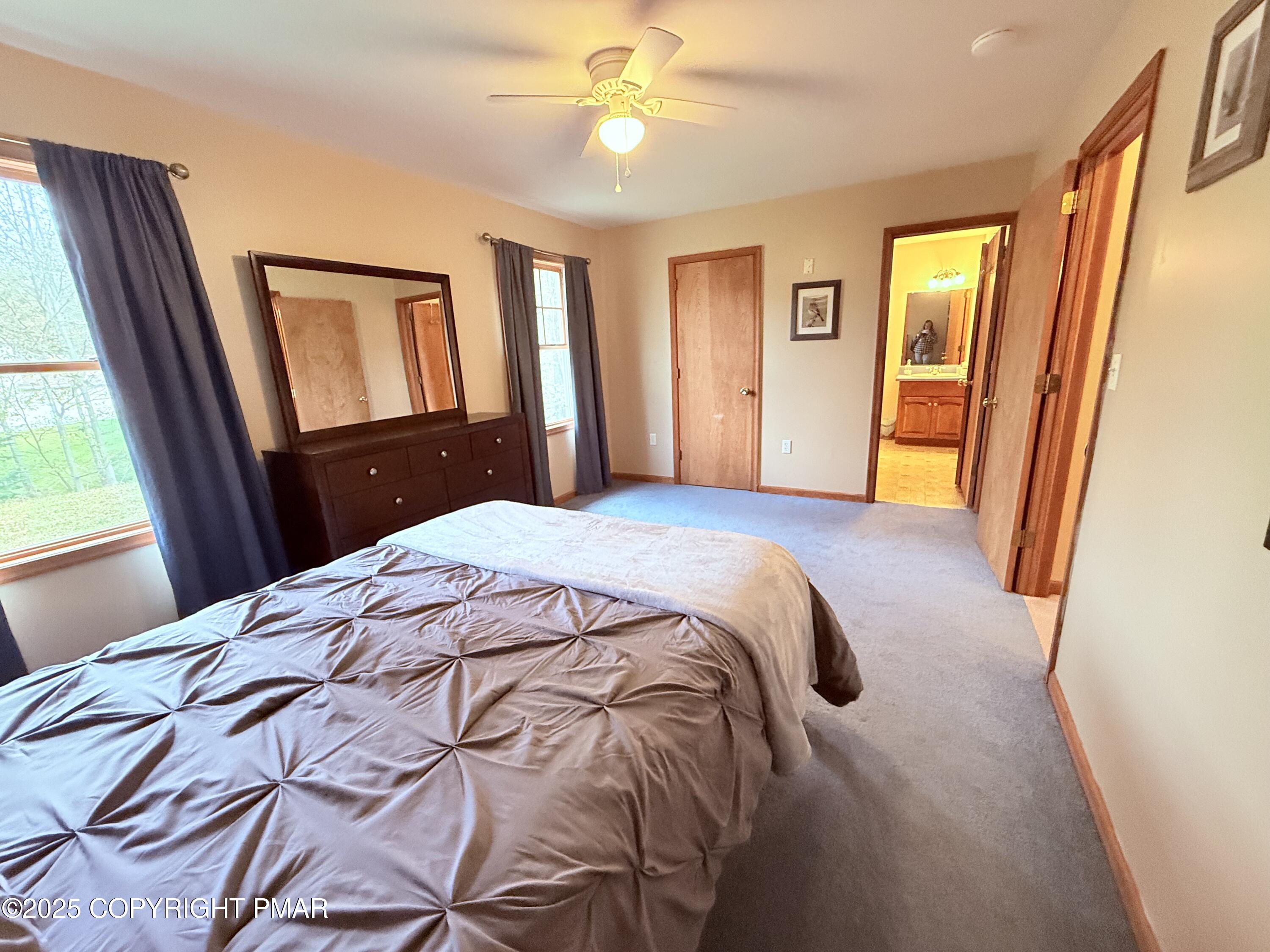 238 Dorset Road Tobyhanna, PA 18466 - Photo 21 of 24 a bedroom with a bed and a large mirror with window