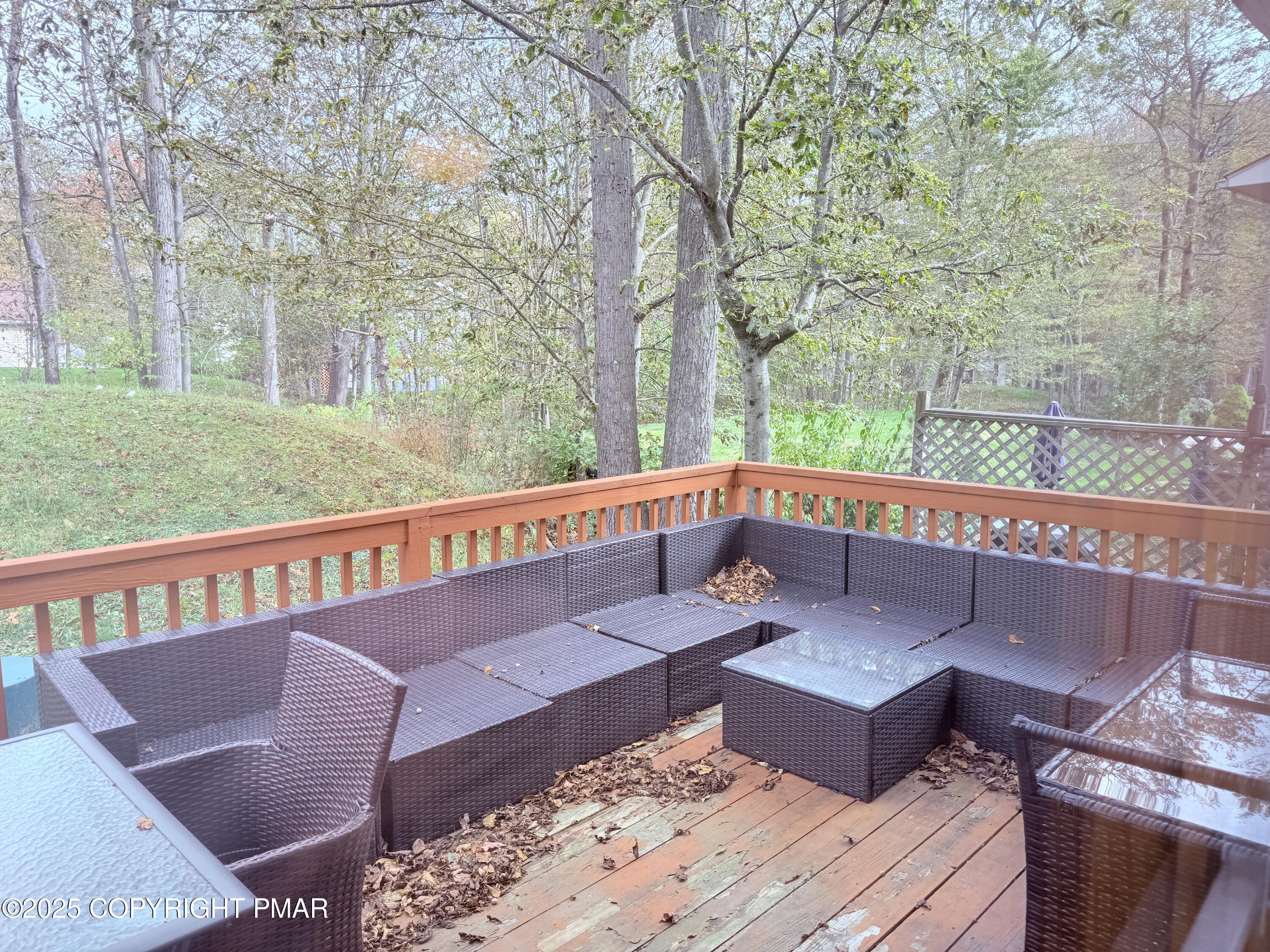 238 Dorset Road Tobyhanna, PA 18466 - Photo 22 of 24 a view of a roof deck with couches and wooden fence