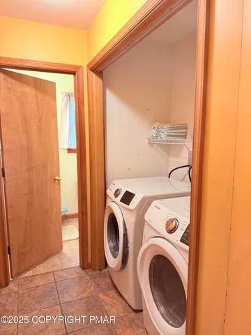 a utility room with dryer and washer