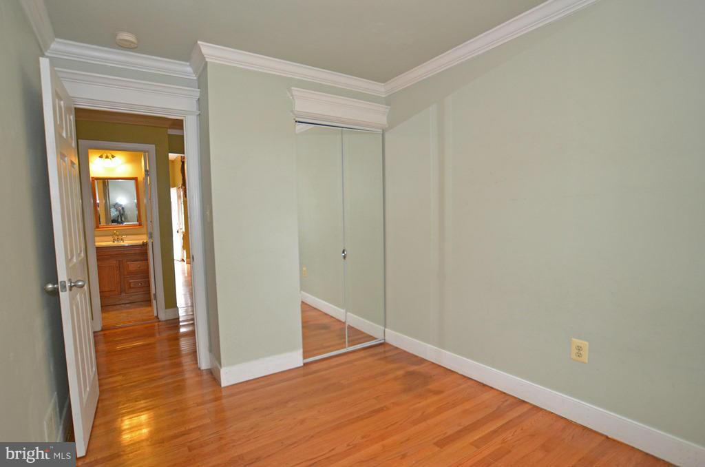 4618 Tema Road Pikesville, MD 21208 - Photo 13 of 29 a view of an empty room with wooden floor and a window