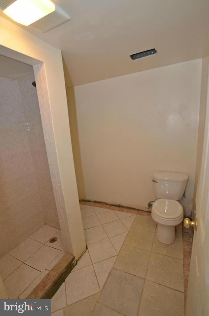 4618 Tema Road Pikesville, MD 21208 - Photo 21 of 29 a bathroom with a toilet and a shower