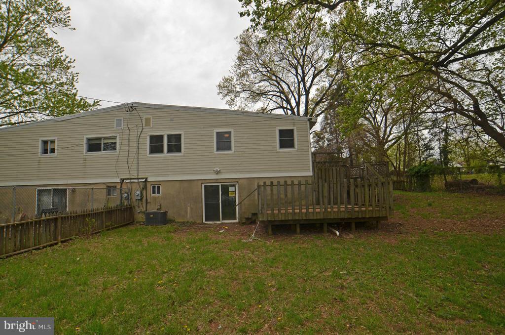 4618 Tema Road Pikesville, MD 21208 - Photo 27 of 29 a view of a house with a yard and a large tree
