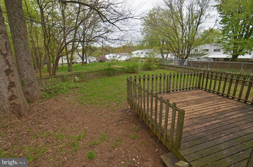 4618 Tema Road Pikesville, MD 21208 - Photo 28 of 29 a view of a wooden deck next to a yard