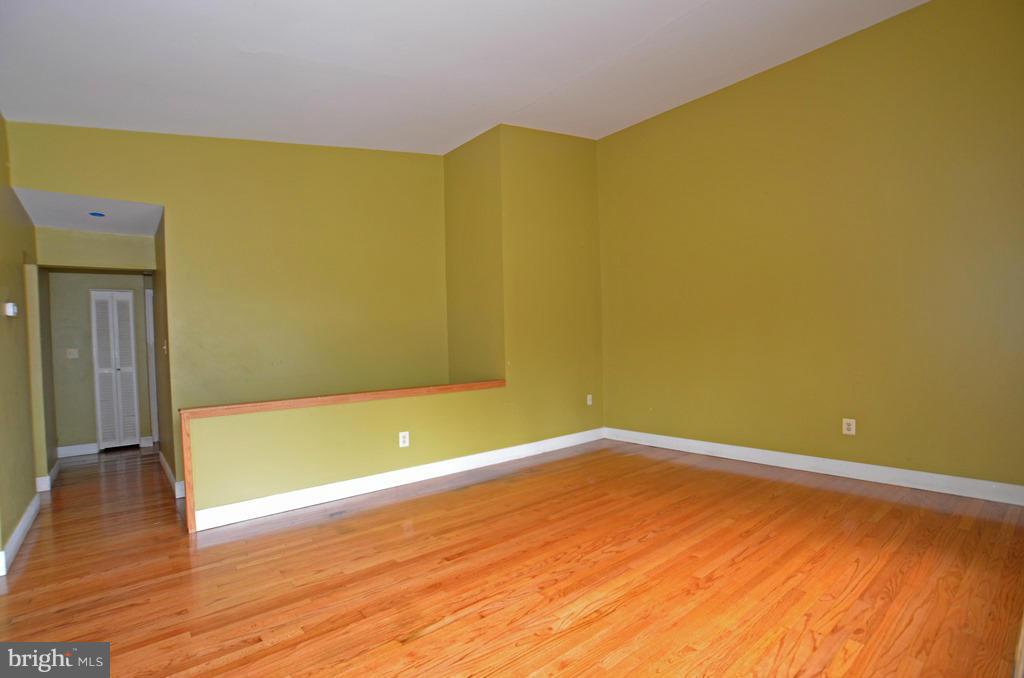 4618 Tema Road Pikesville, MD 21208 - Photo 4 of 29 a view of empty room with wooden floor