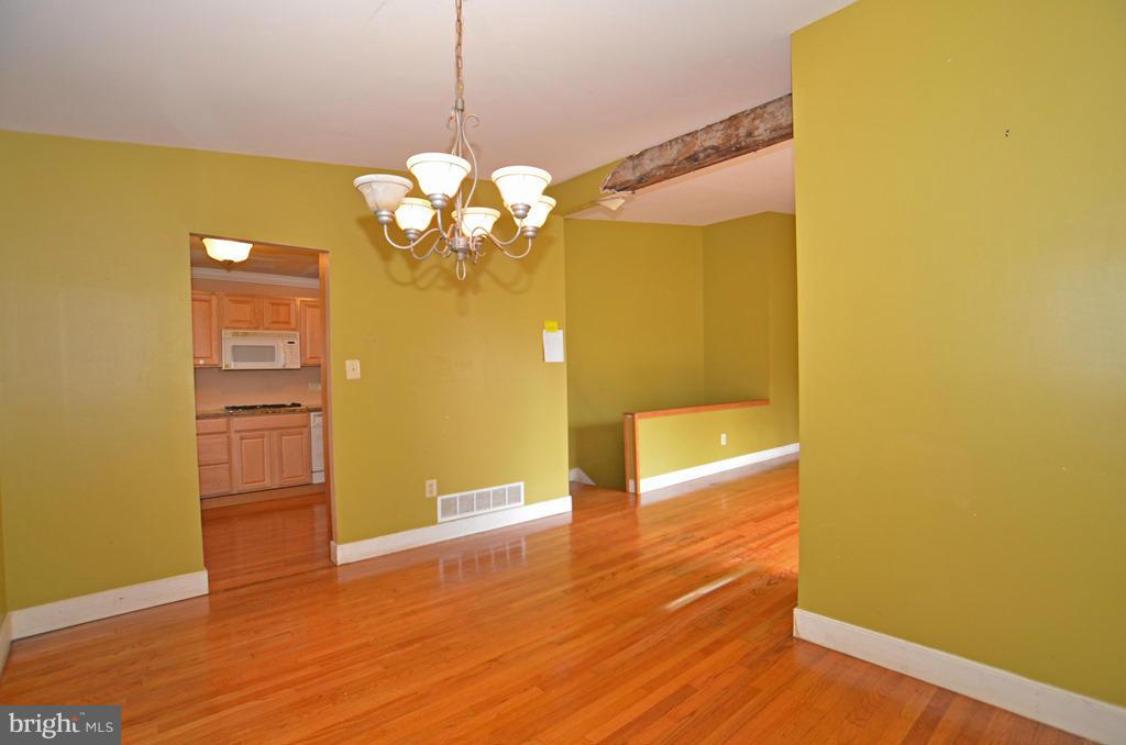4618 Tema Road Pikesville, MD 21208 - Photo 6 of 29 a view of a kitchen with wooden floor