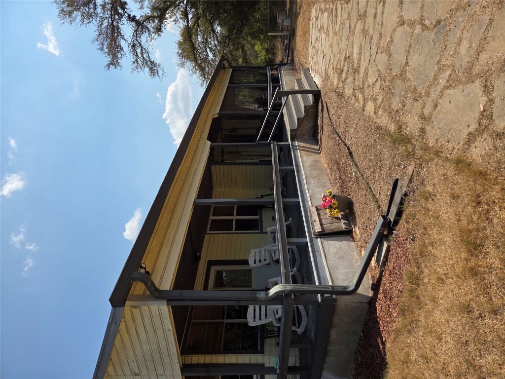 150 Beaver Road Elgin, TX 78621 - Photo 2 of 40 a view of a chairs and table in backyard of the house