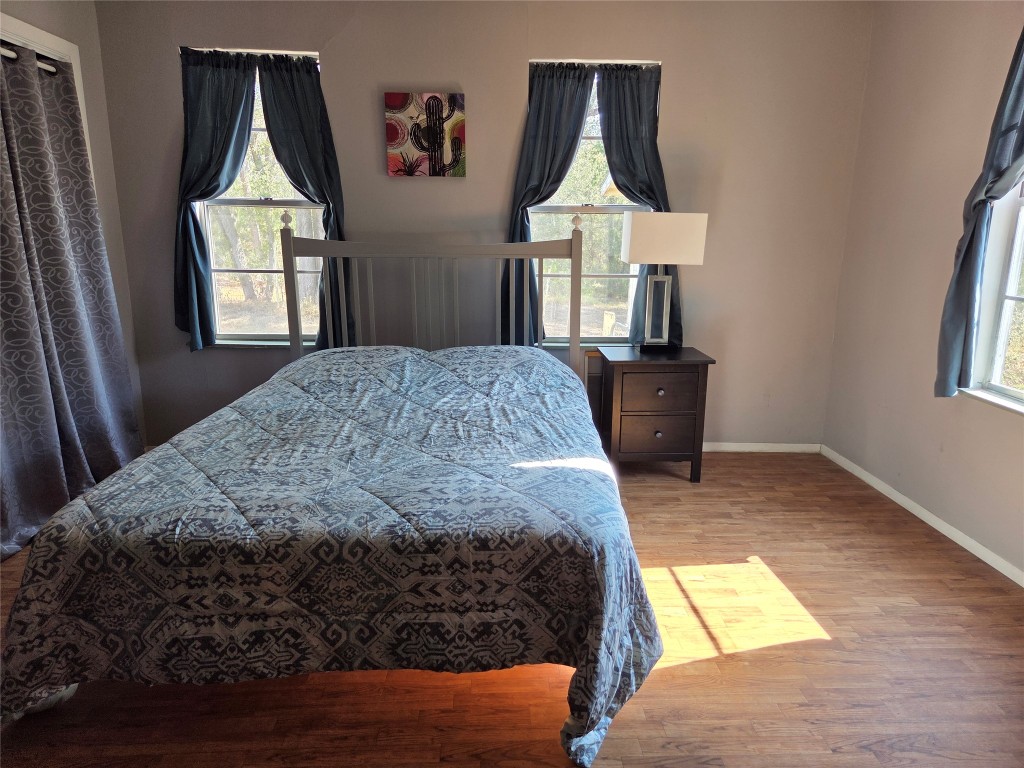 150 Beaver Road Elgin, TX 78621 - Photo 21 of 40 a bedroom with a bed and a window