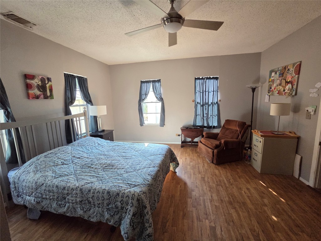 150 Beaver Road Elgin, TX 78621 - Photo 22 of 40 a bed room with a bed window and a dresser