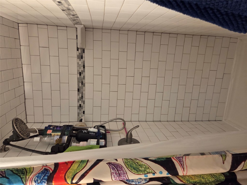 150 Beaver Road Elgin, TX 78621 - Photo 23 of 40 a bathroom with a shower