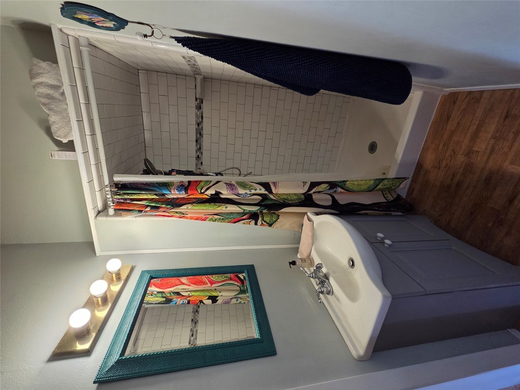 150 Beaver Road Elgin, TX 78621 - Photo 24 of 40 a bathroom with a sink and mirror