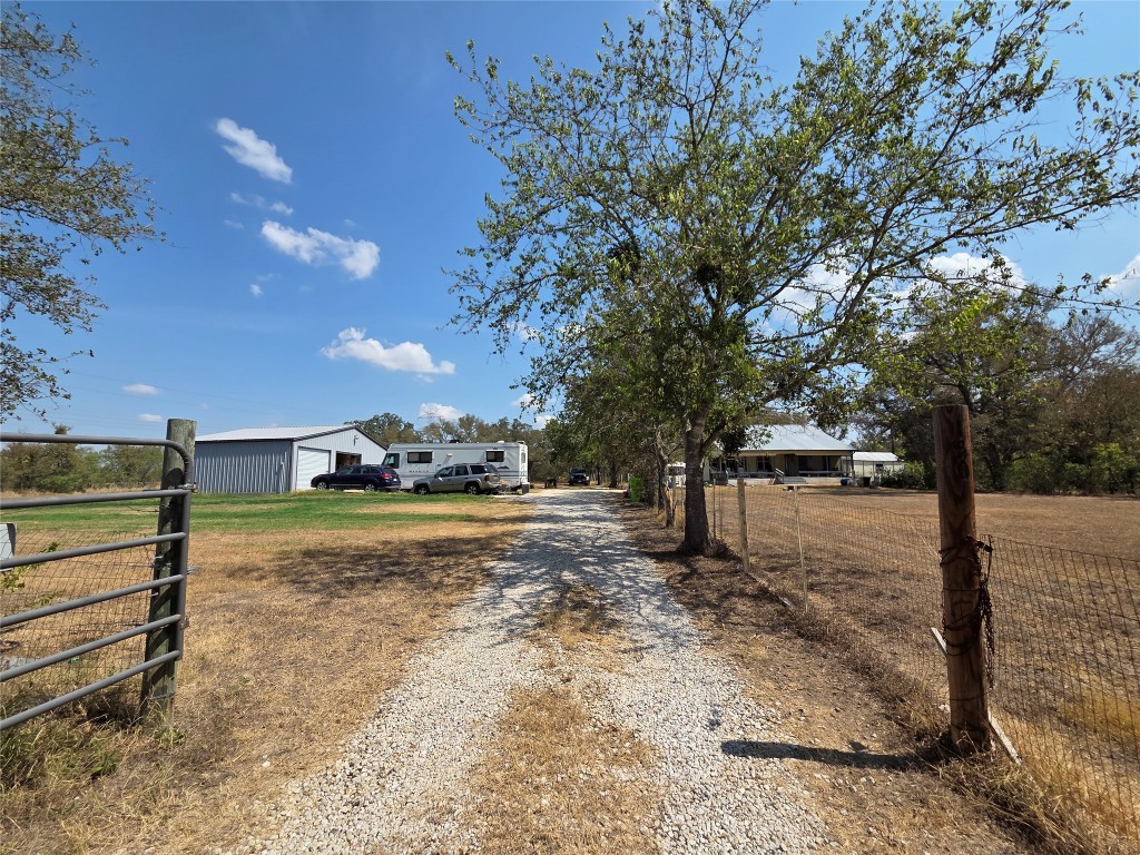 150 Beaver Road Elgin, TX 78621 - Photo 3 of 40 a view of a yard with wooden fence