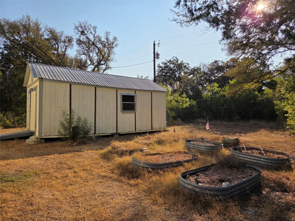 150 Beaver Road Elgin, TX 78621 - Photo 37 of 40 a backyard of a house with fire pit and outdoor seating