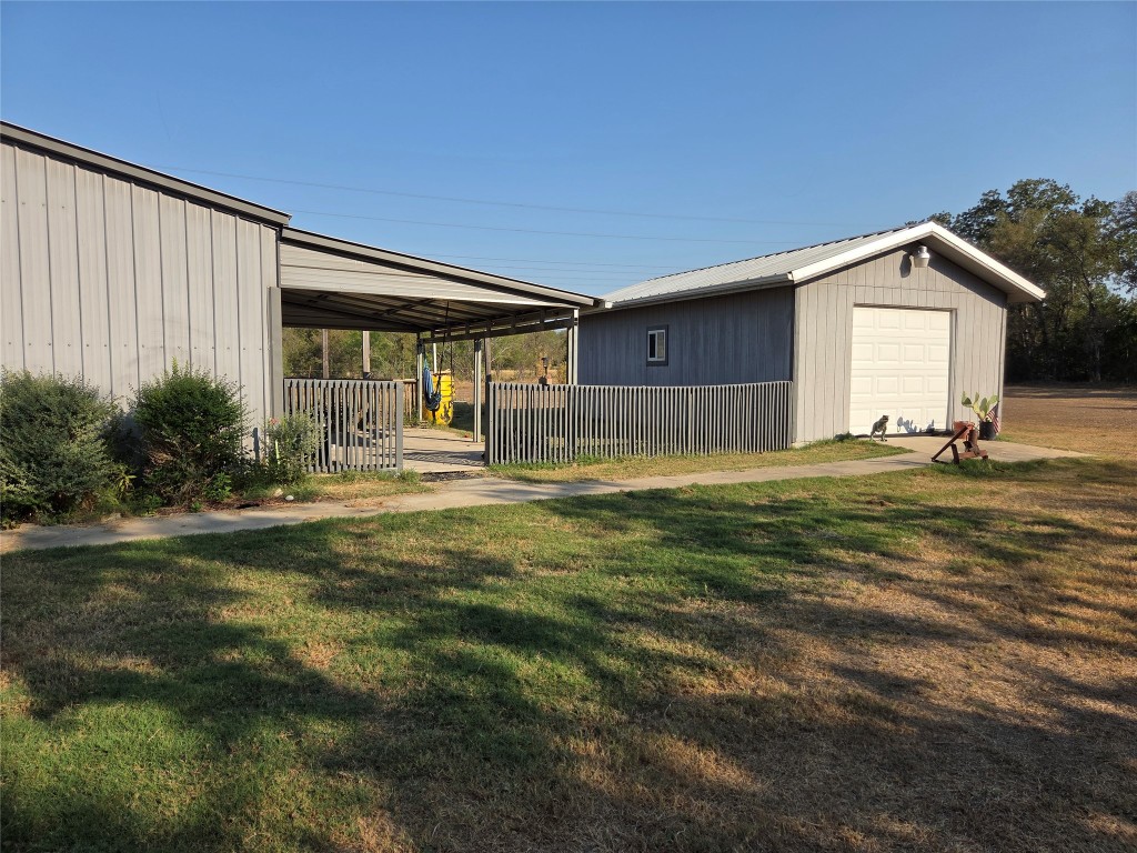150 Beaver Road Elgin, TX 78621 - Photo 5 of 40 a front view of a house with garden