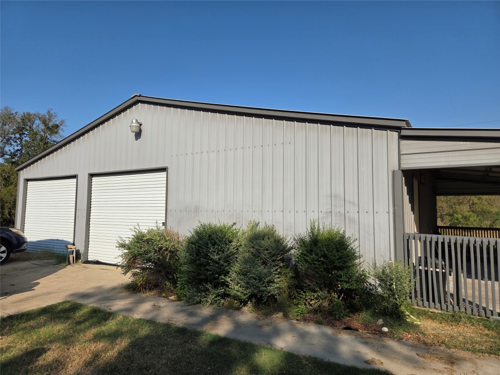150 Beaver Road Elgin, TX 78621 - Photo 6 of 40 a backyard of a house with plants and trees
