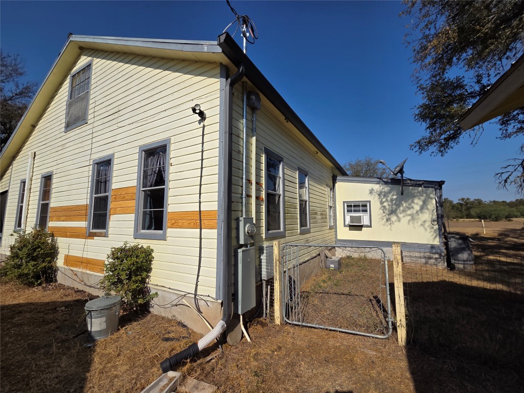 150 Beaver Road Elgin, TX 78621 - Photo 9 of 40 a front view of a house with a yard