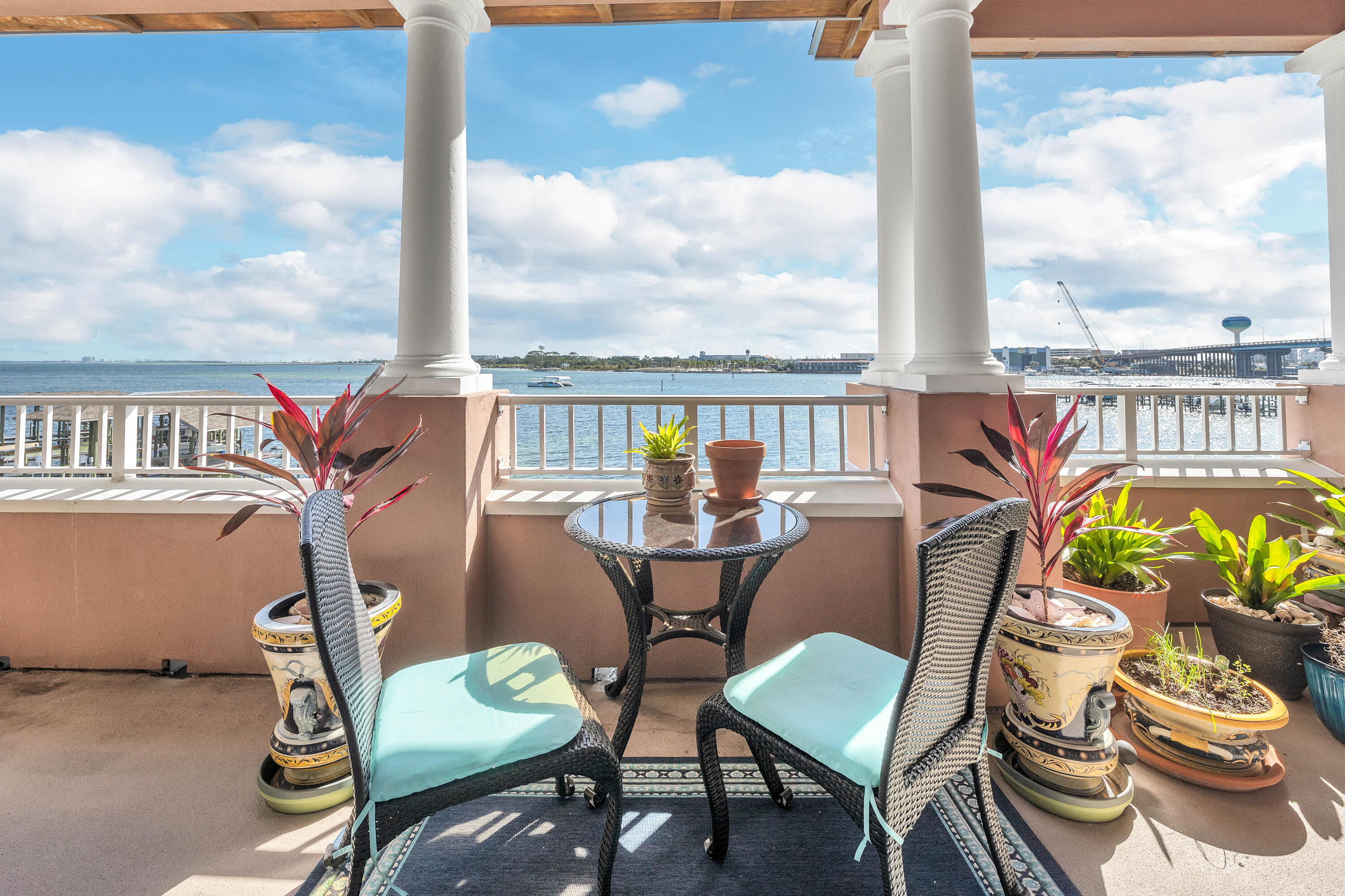 240 Brooks Street Southeast, Unit D301 Fort Walton Beach, FL 32548 - Photo 5 of 17 a view of a balcony with chairs and a potted plant