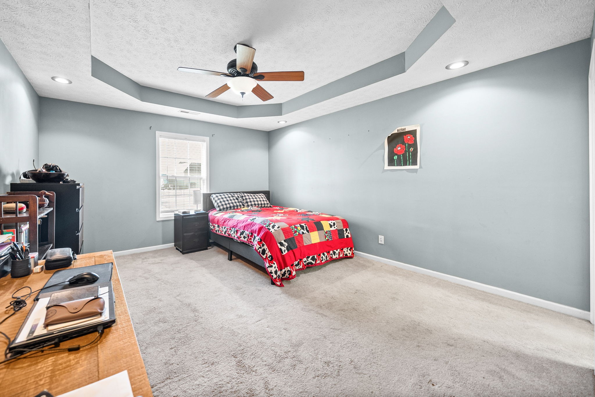 1940 Loop Lane Gracey, KY 42232 - Photo 14 of 32 a bedroom with a bed and a chandelier