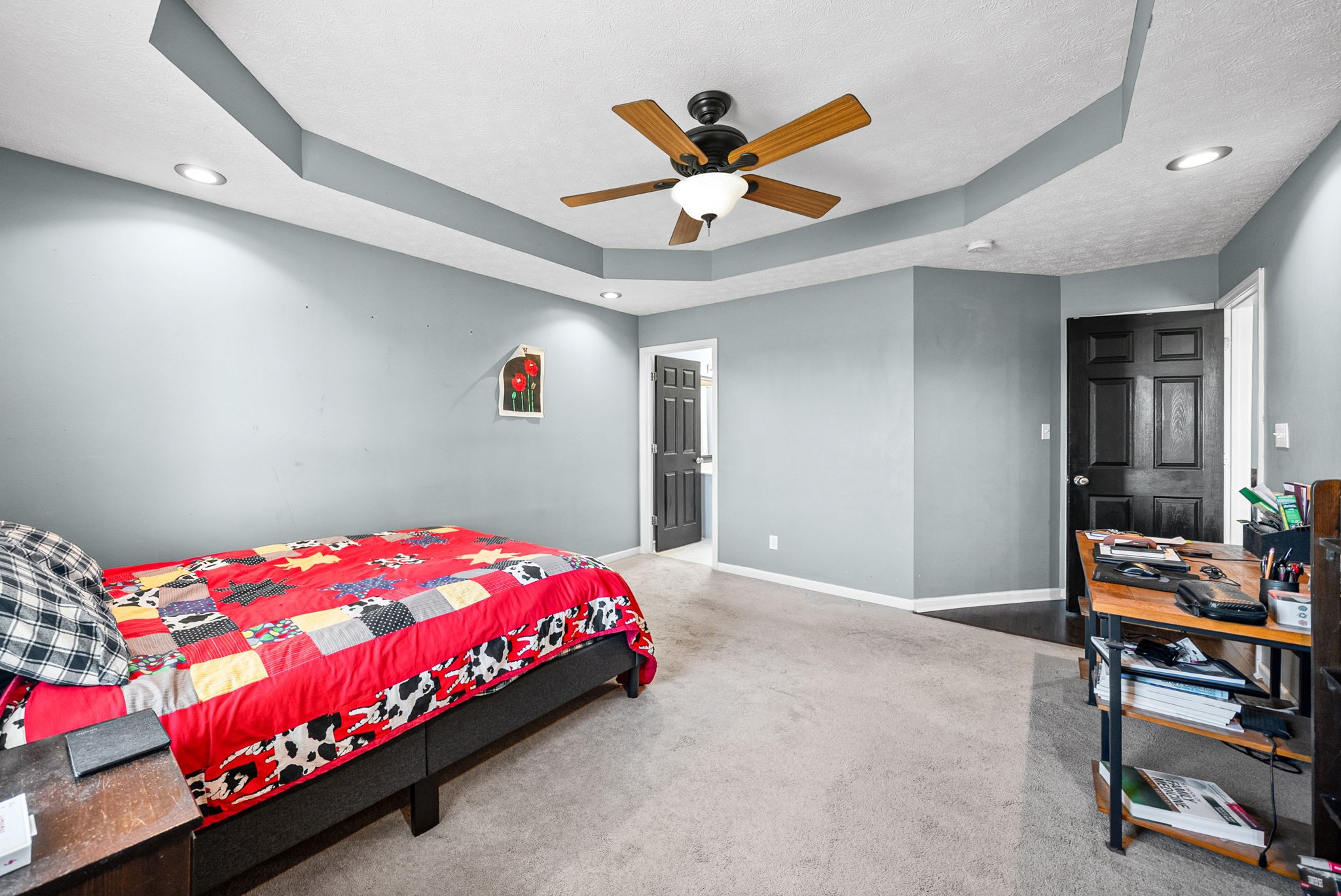 1940 Loop Lane Gracey, KY 42232 - Photo 16 of 32 a bedroom with a bed and a chandelier