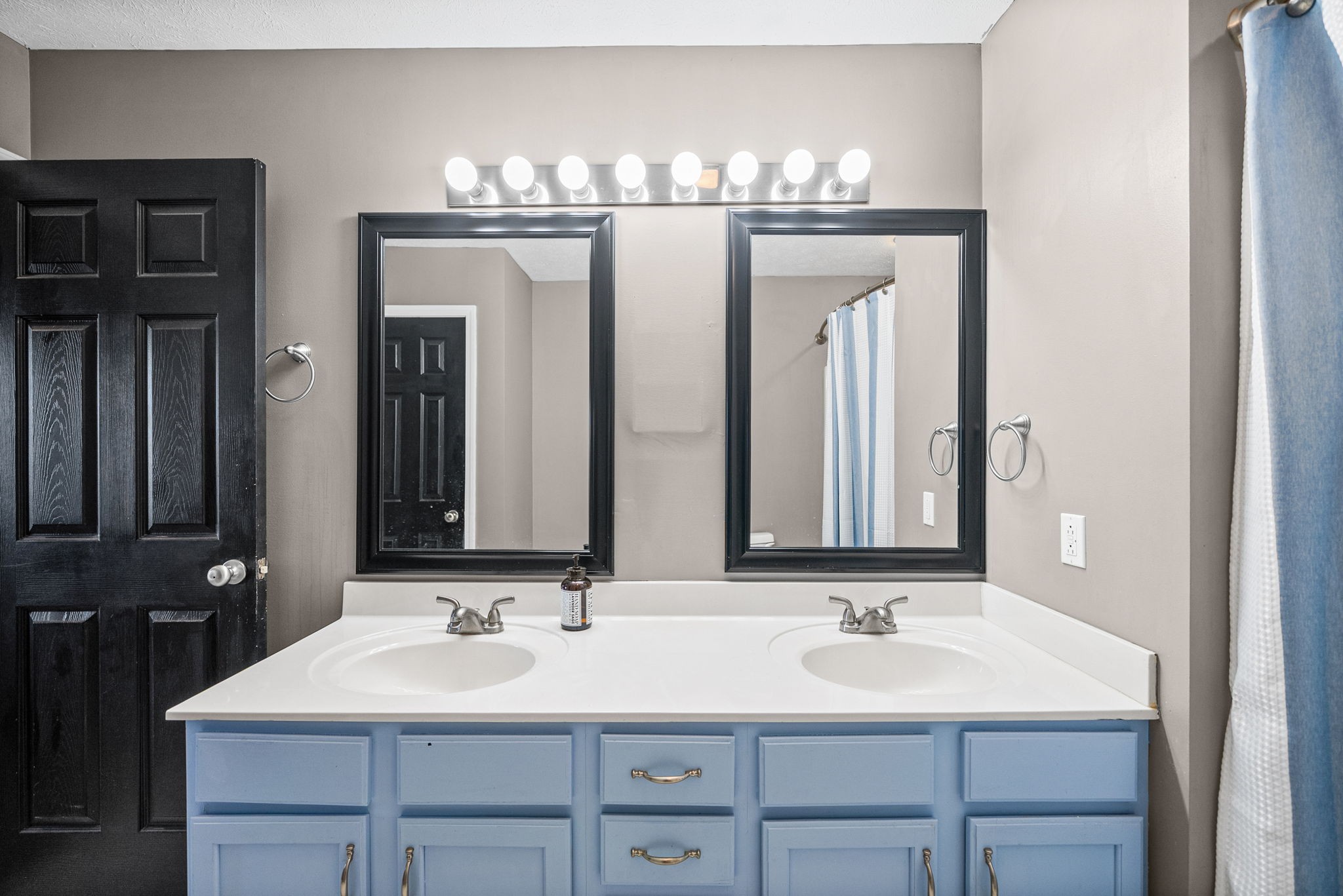 1940 Loop Lane Gracey, KY 42232 - Photo 18 of 32 a bathroom with a double vanity sink and a mirror