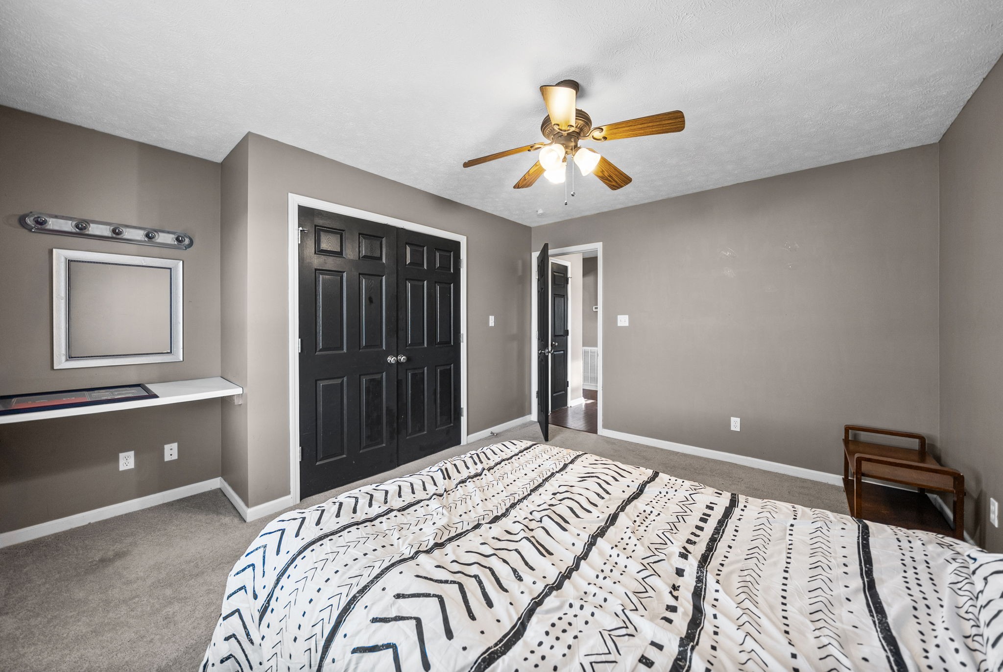 1940 Loop Lane Gracey, KY 42232 - Photo 21 of 32 a bedroom with a bed and a chandelier