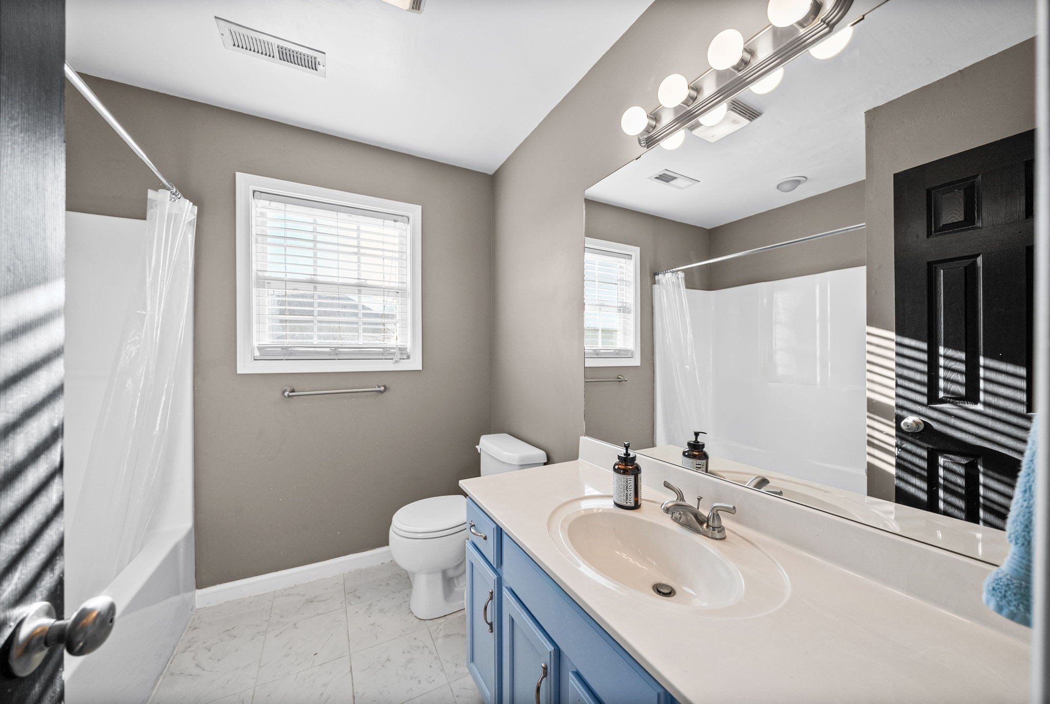 1940 Loop Lane Gracey, KY 42232 - Photo 22 of 32 a bathroom with a sink a toilet and a mirror