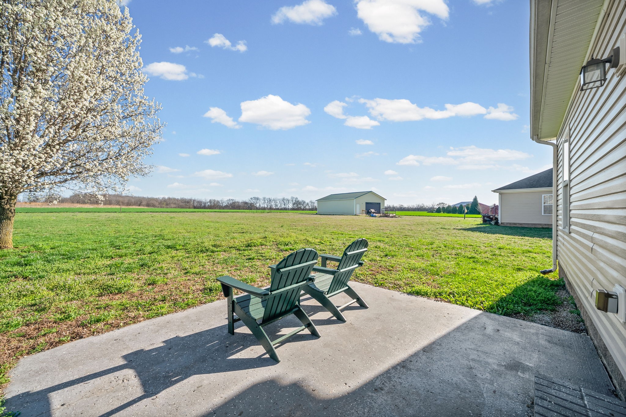 1940 Loop Lane Gracey, KY 42232 - Photo 28 of 32 a view of a lake with a yard and outdoor seating