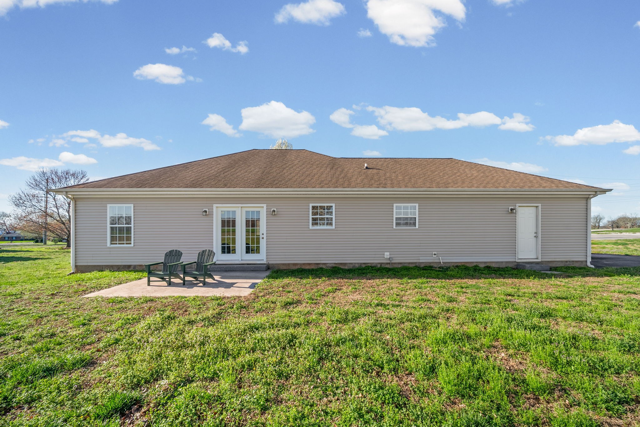 1940 Loop Lane Gracey, KY 42232 - Photo 30 of 32 a backyard of a house with table and chairs