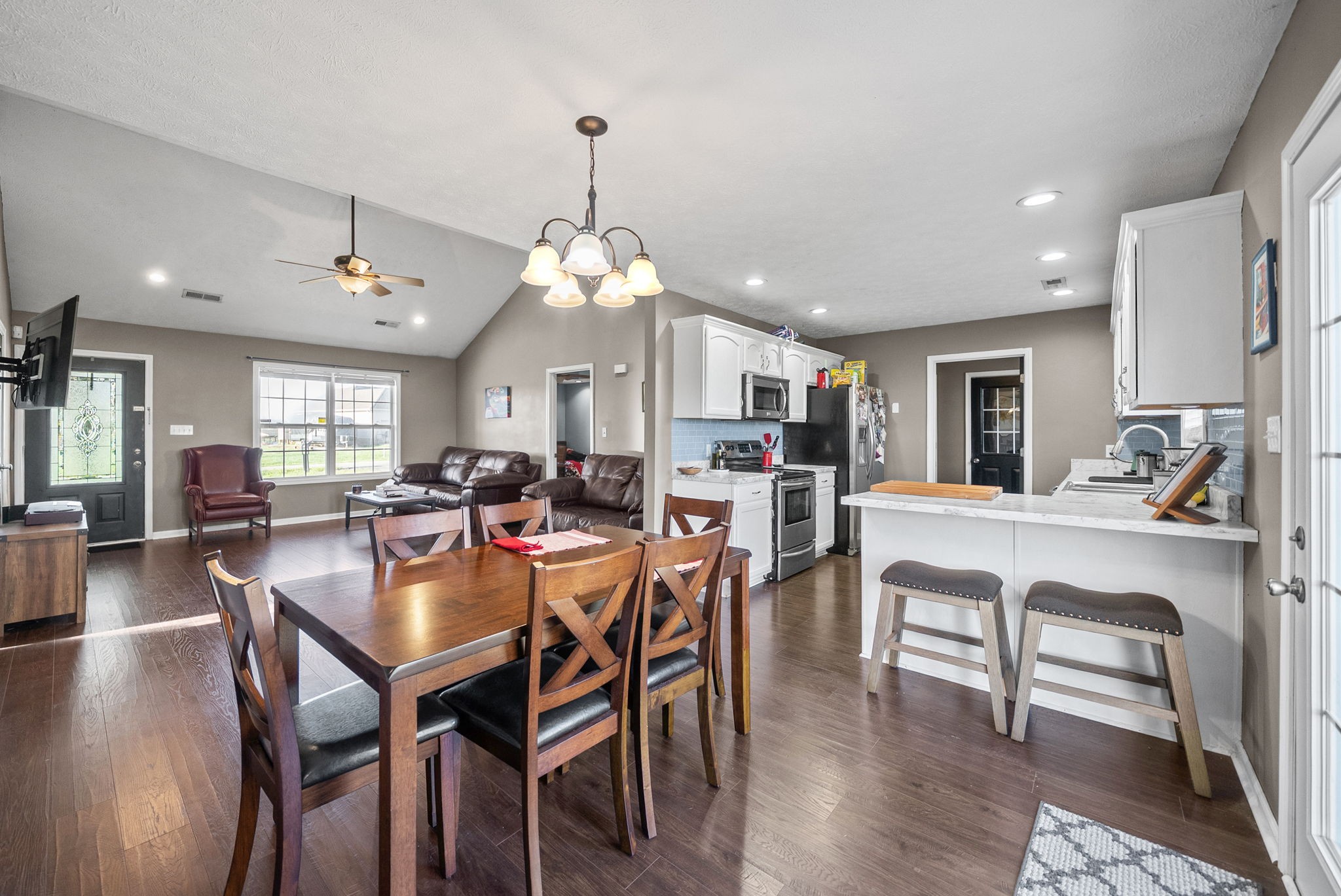 1940 Loop Lane Gracey, KY 42232 - Photo 7 of 32 a view of a dining room and livingroom with furniture wooden floor a chandelier