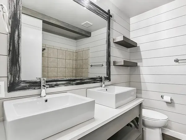 a bathroom with a sink and a mirror