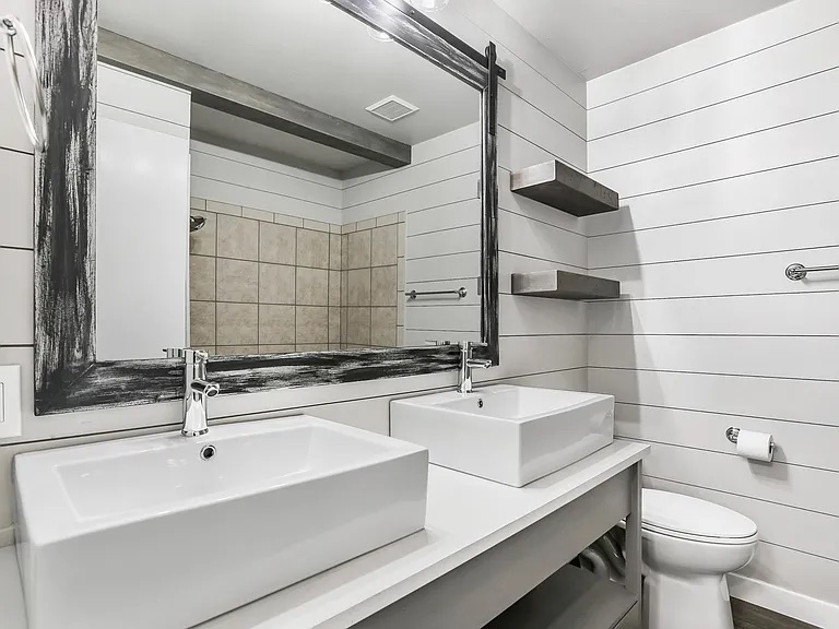 5330 Balcones Drive, Unit C Austin, TX 78731 - Photo 3 of 6 a bathroom with a sink and a mirror