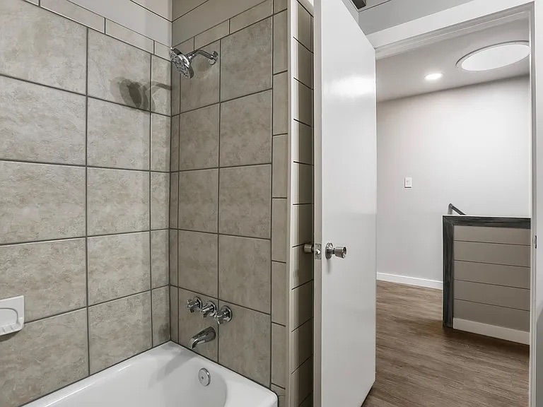 5330 Balcones Drive, Unit C Austin, TX 78731 - Photo 4 of 6 a bathroom with a bathtub and shower
