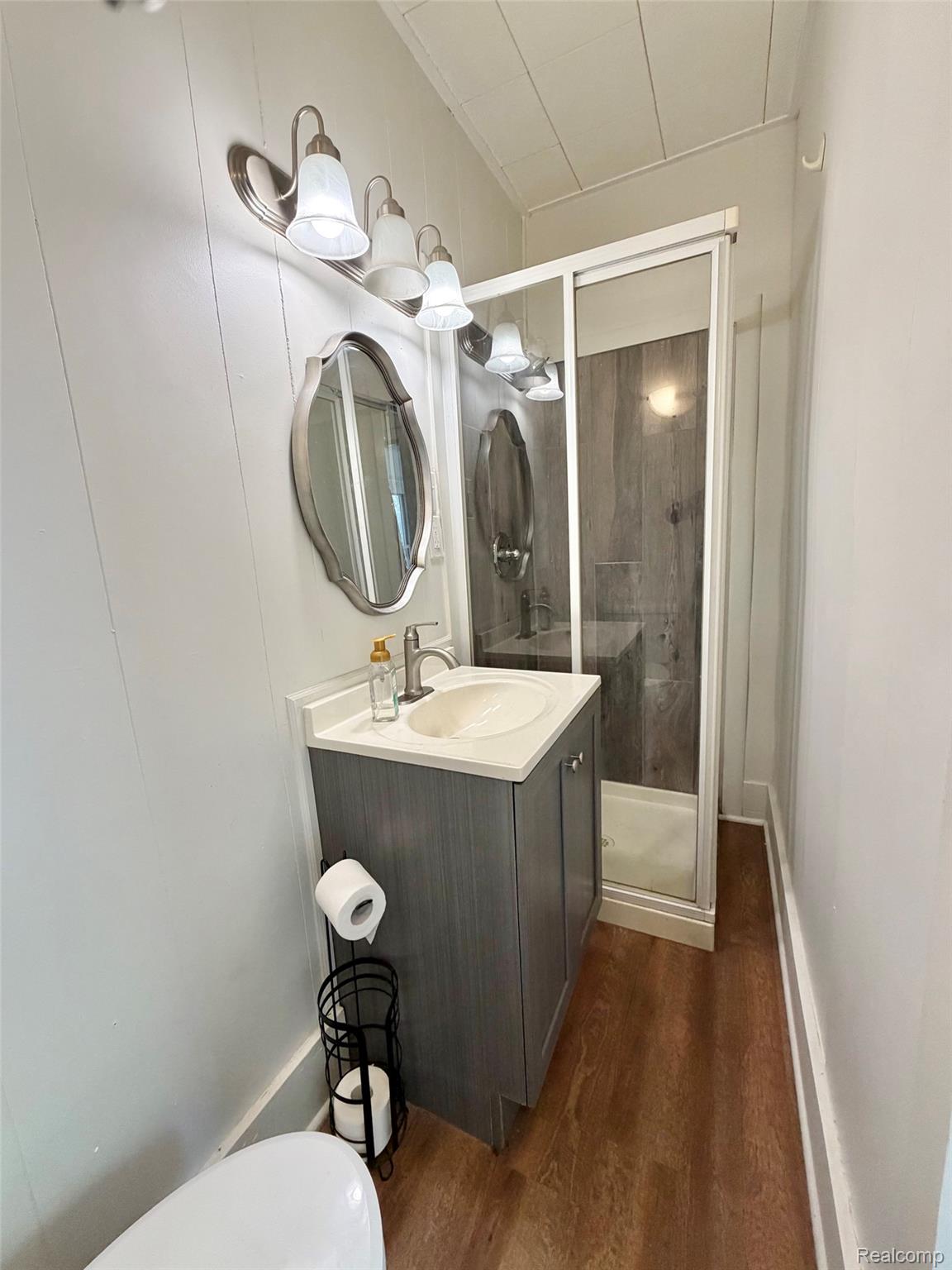 2840 Miller Road Flint, MI 48503 - Photo 21 of 49 Modern vanity with integrated sink, chrome faucet, and white countertop