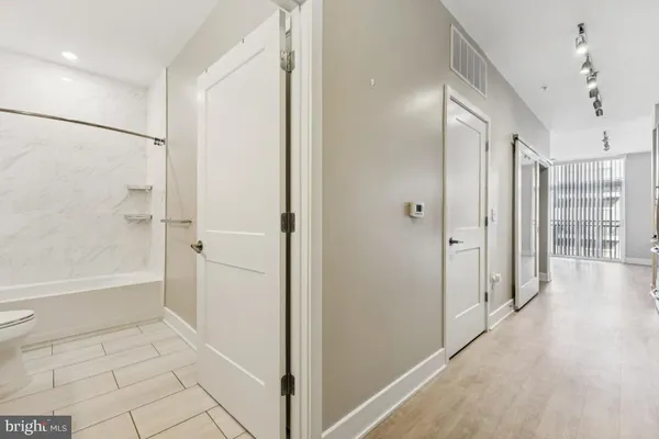 a bathroom with a bathtub and a shower