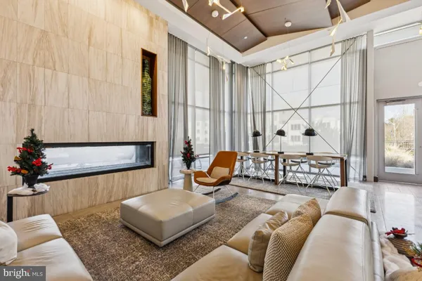 a living room with furniture and flowers