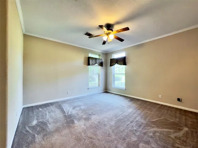 a view of a big room with carpet