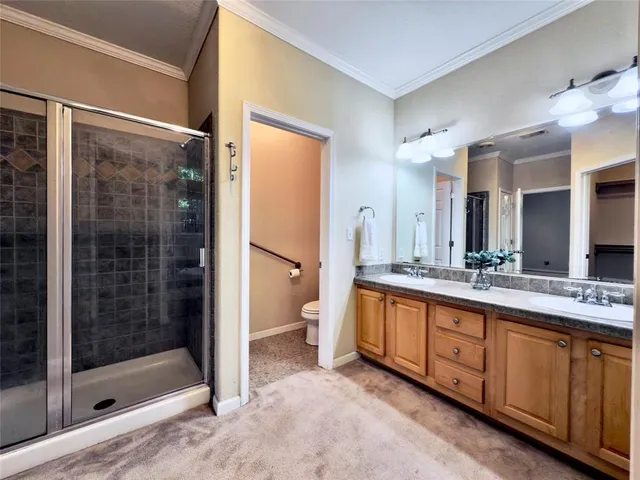 a bathroom with a shower sink and mirror