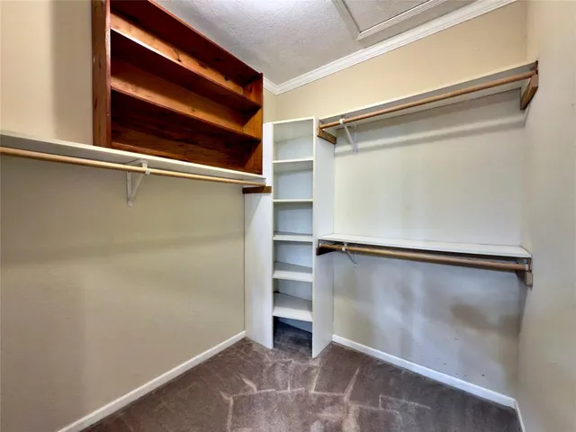 a view of an empty walk in closet