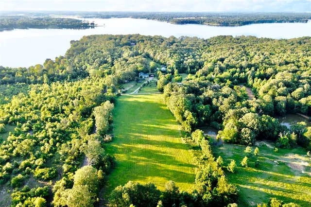 a view of a lake with a big yard