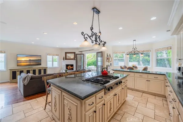 a kitchen with stainless steel appliances granite countertop a sink and stove