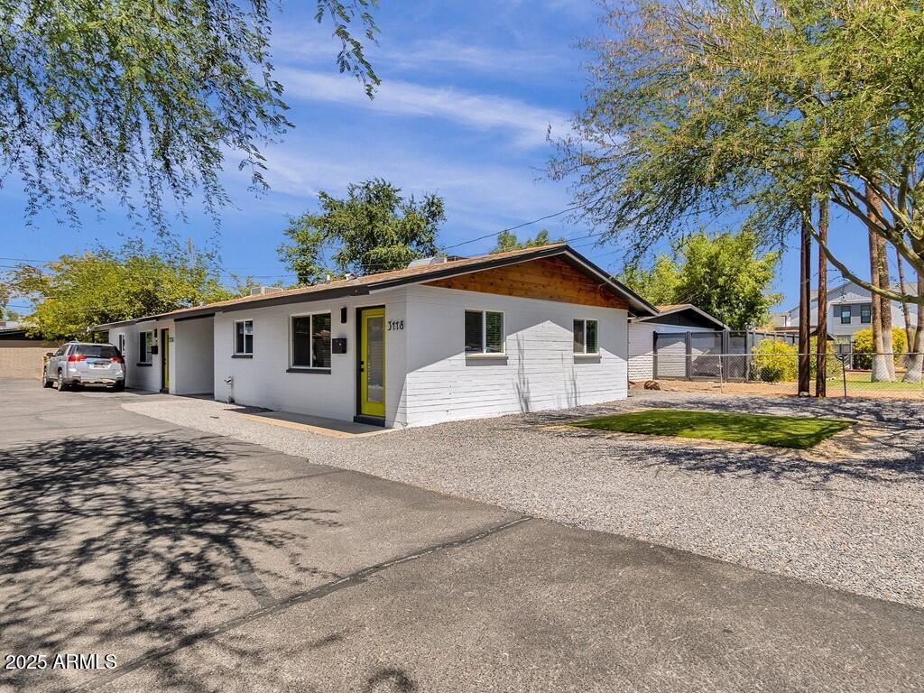 3116 North 39th Street Phoenix, AZ 85018 - Photo 1 of 22 a view of a house with a yard and large trees