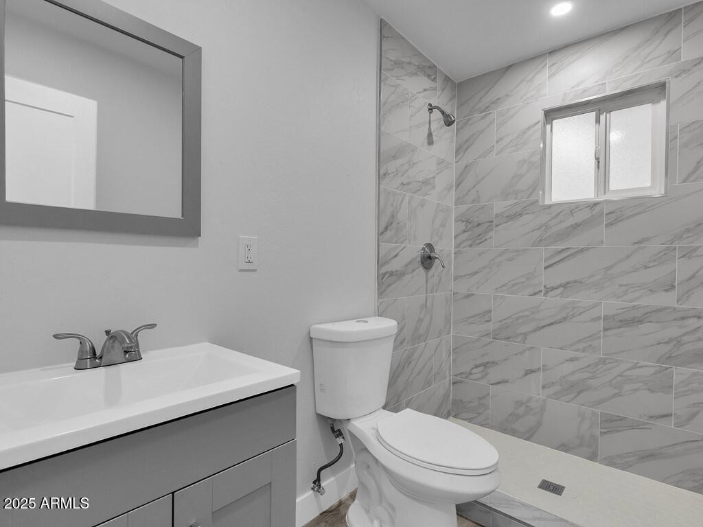 3116 North 39th Street Phoenix, AZ 85018 - Photo 17 of 22 a bathroom with a sink a toilet and shower