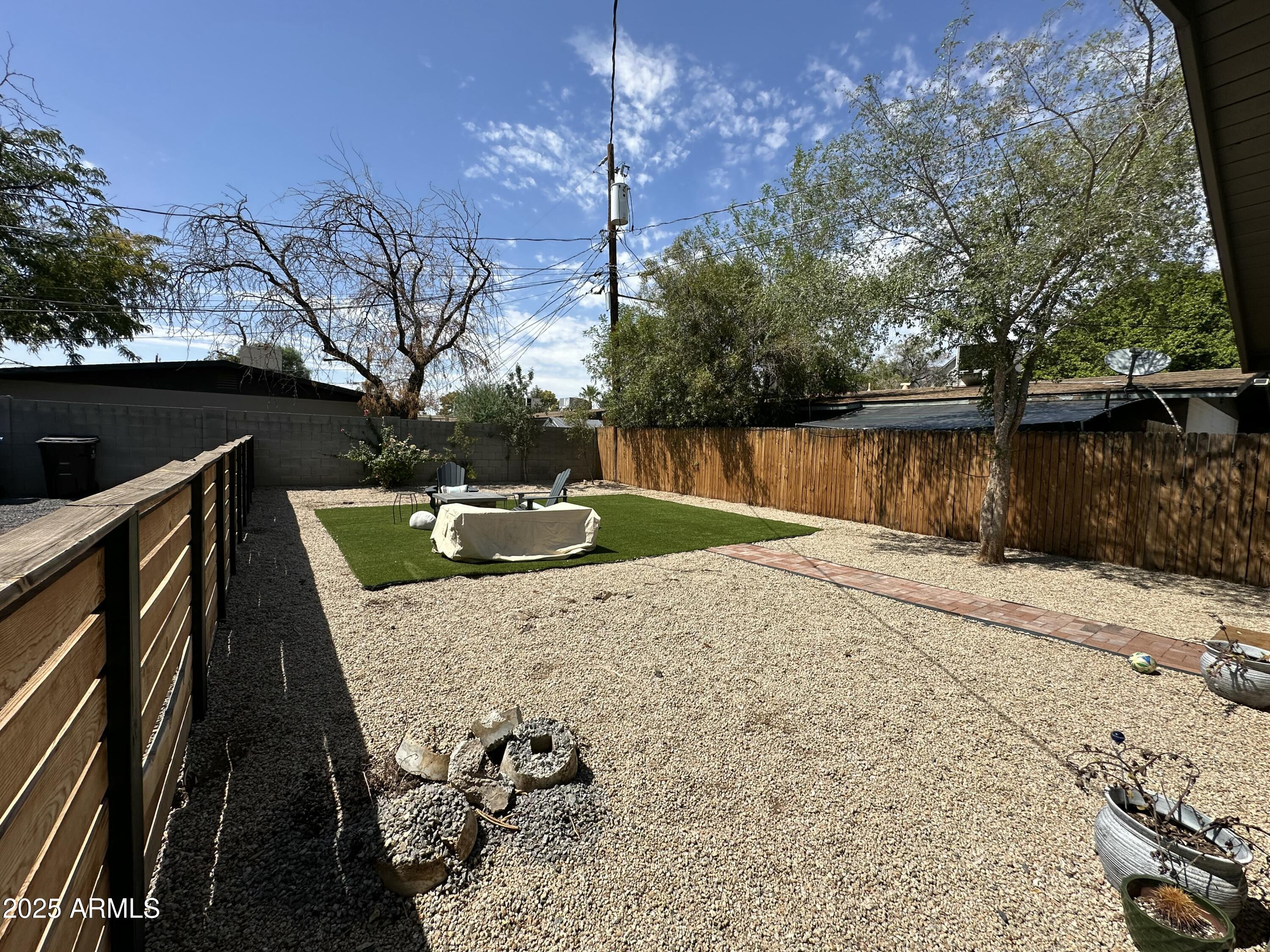 3116 North 39th Street Phoenix, AZ 85018 - Photo 19 of 22 a view of a lake with couches and wooden floor