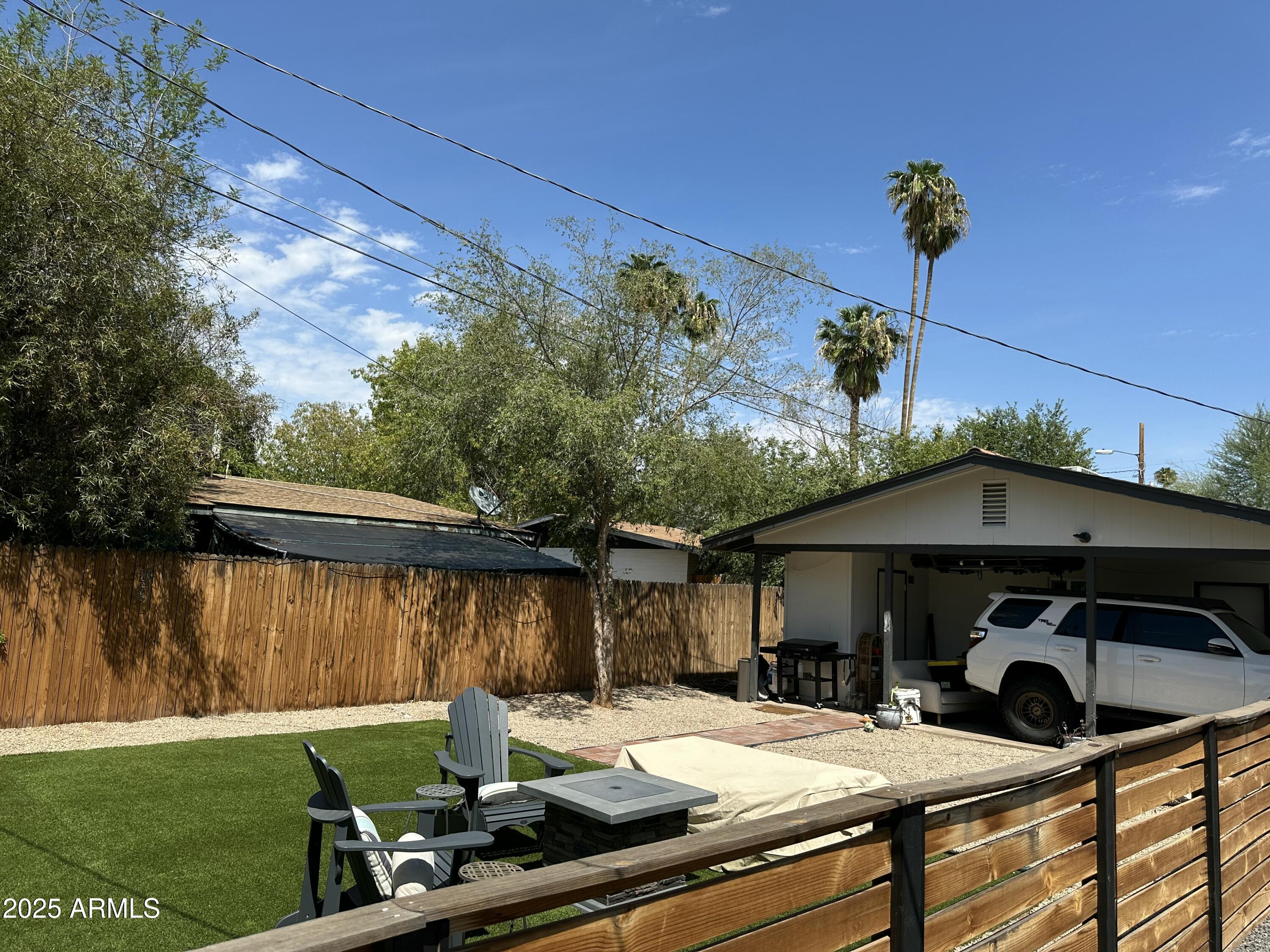 3116 North 39th Street Phoenix, AZ 85018 - Photo 22 of 22 a view of a house with backyard water fountain and sitting area