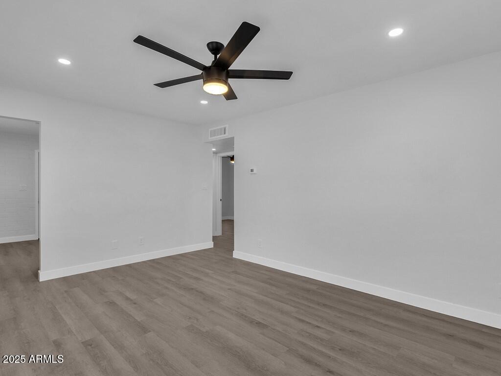 3116 North 39th Street Phoenix, AZ 85018 - Photo 4 of 22 a view of a big room with wooden floor windows