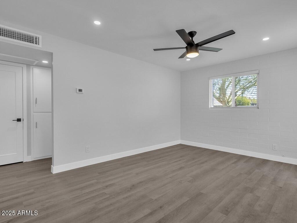 3116 North 39th Street Phoenix, AZ 85018 - Photo 5 of 22 wooden floor in an empty room with a window