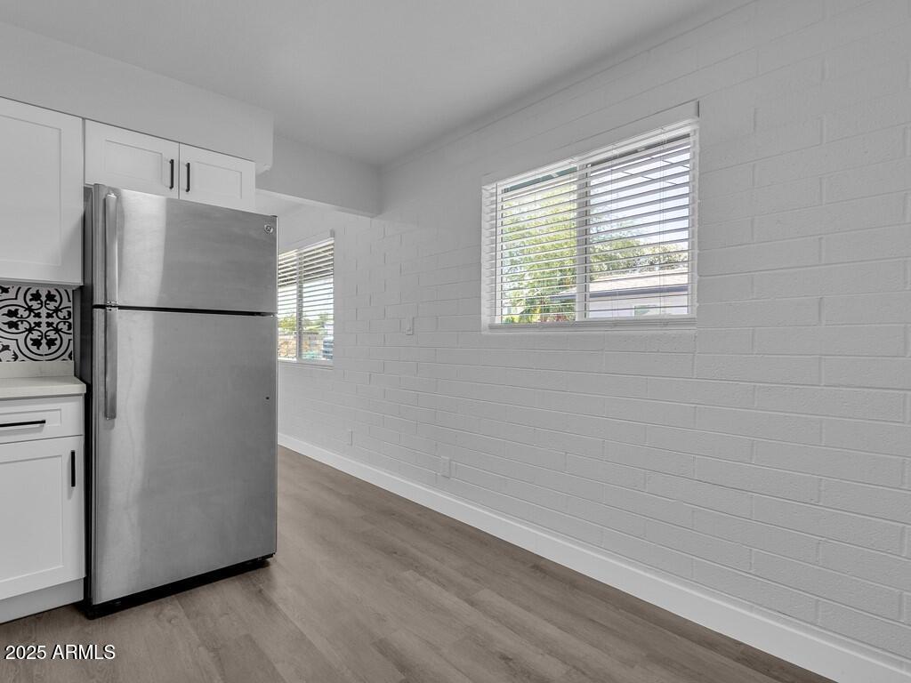 3116 North 39th Street Phoenix, AZ 85018 - Photo 10 of 22 a view of a kitchen with a closet and a window