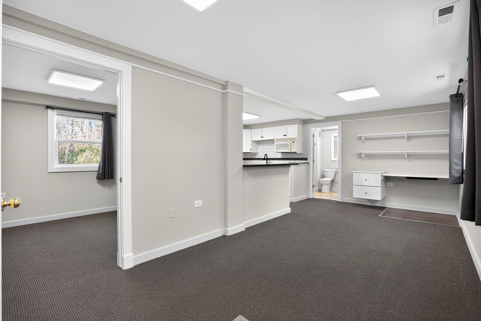 1036 Guerin Road, Unit B Green Oaks, IL 60048 - Photo 13 of 17 a view of a kitchen with wooden cabinet and a refrigerator