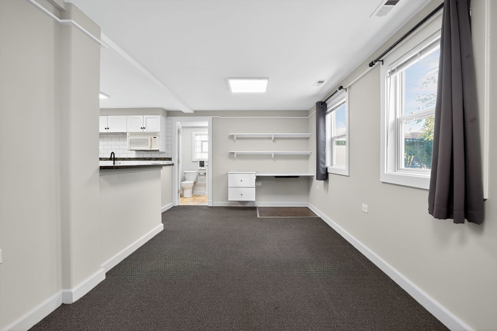 1036 Guerin Road, Unit B Green Oaks, IL 60048 - Photo 17 of 17 a view of a kitchen with a sink and dishwasher cabinets