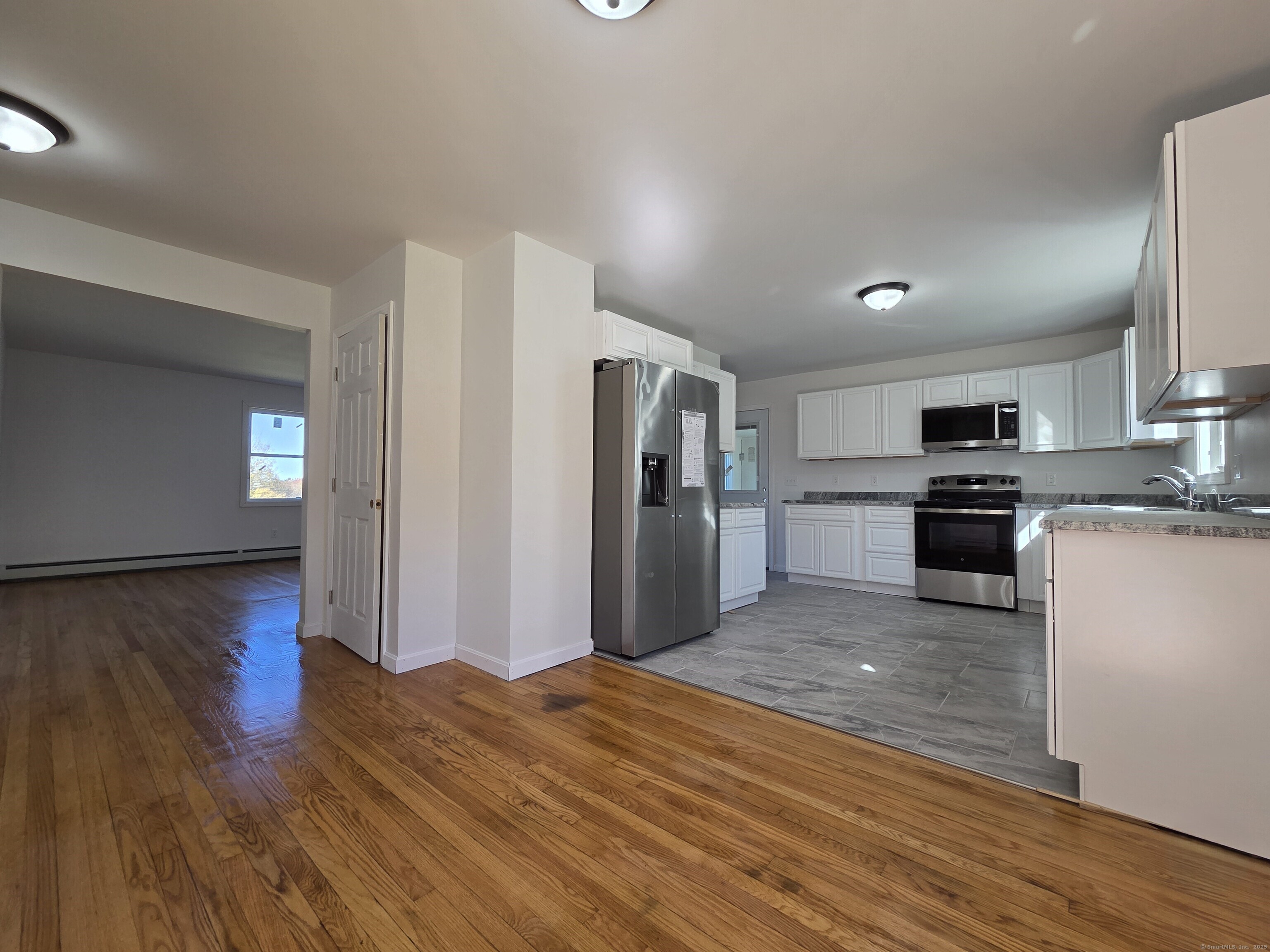 395 Bailey Hill Road Killingly, CT 06239 - Photo 8 of 36 a kitchen with stainless steel appliances granite countertop a refrigerator sink and stove