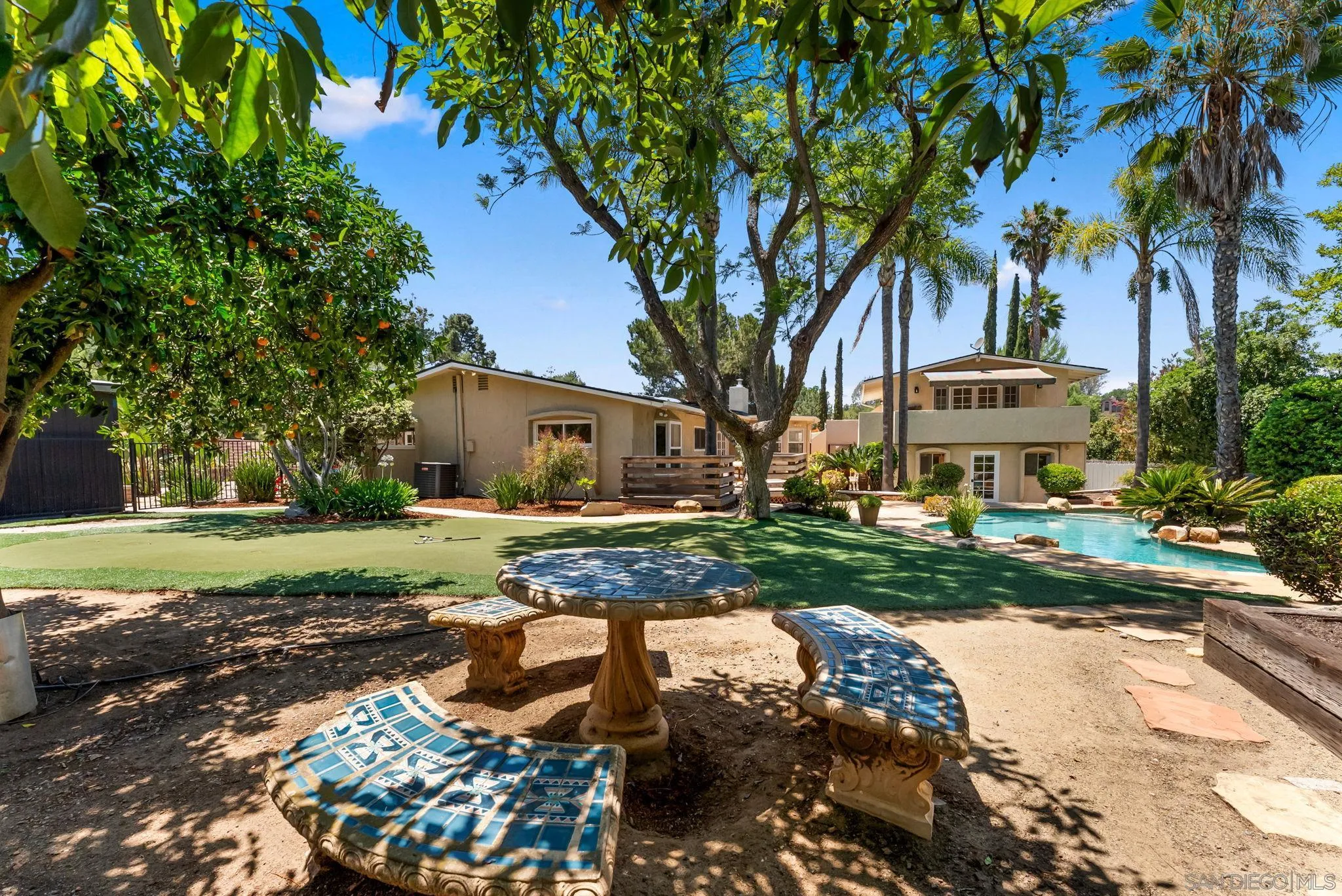 12832 Stone Canyon Road Poway, CA 92064 - Photo 45 of 60 a front view of a house with garden